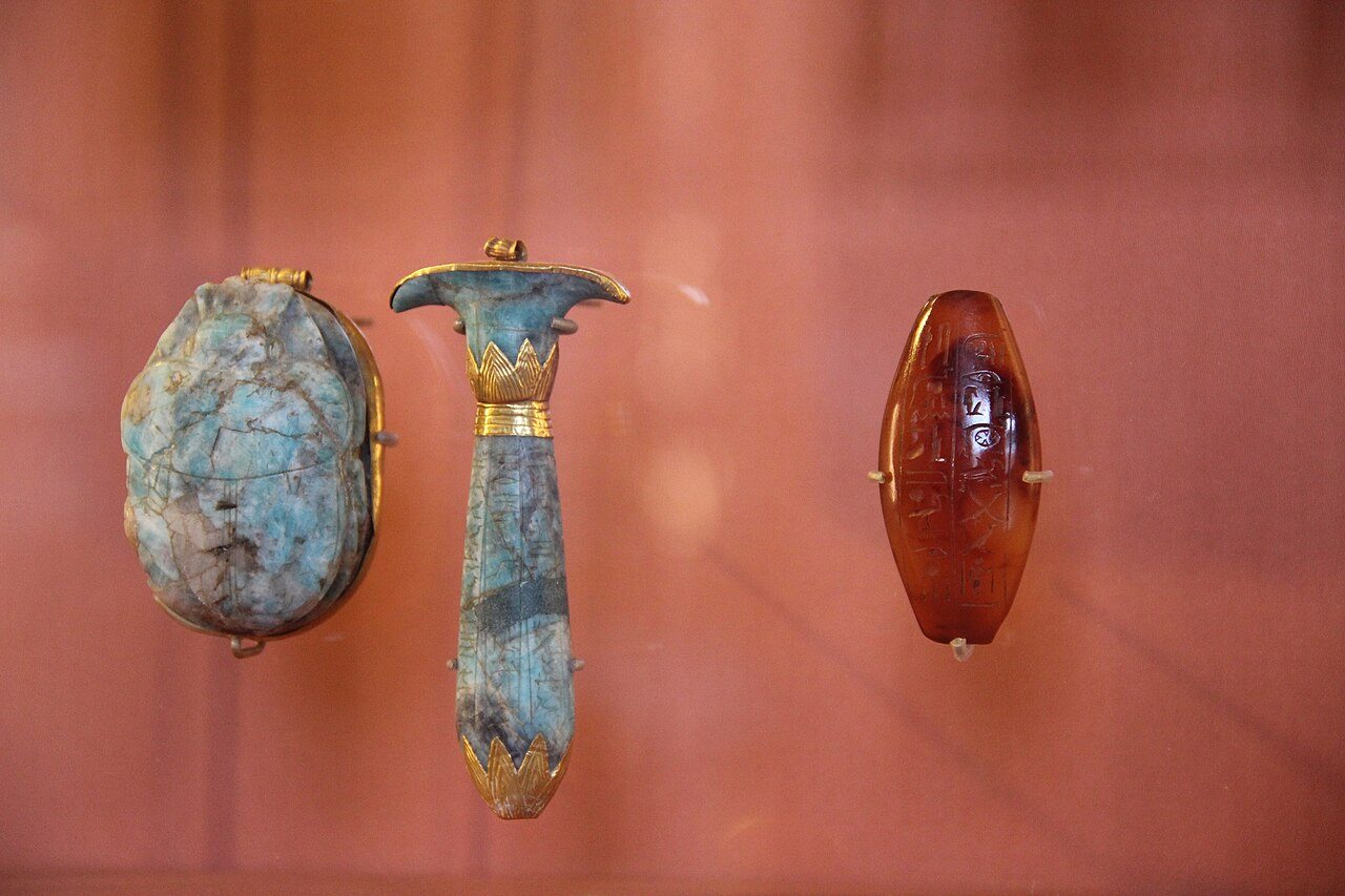 Egyptian faience, gold and amber objects shown together
